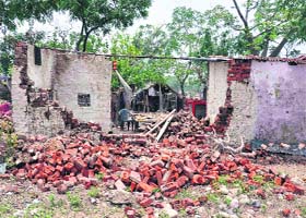 A house damaged by flood waters in the Bairagi camp area of Haridwar