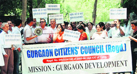 Members of the Gurgaon Citizens Council protest in front of the HUDA office in protest against waterlogging in the cyber city on Thursday.