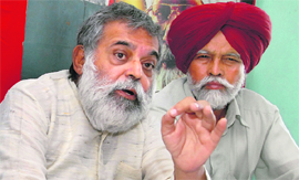 Suneet Chopra (L), CPM centre panel member