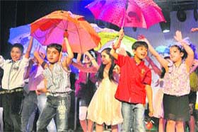 Dancing in the rain: Children perform unbrella dance on the concluding day of a summer camp organised in Jalandhar on Thursday
