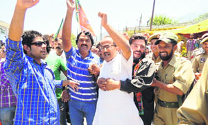 BJP national executive committee member Dr Nirmal Singh being arrested by the police along with other workers in Ramban.