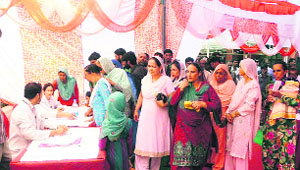 Patients being examined at a medical camp in Rajouri on Thursday. 