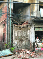The portion of the building that caved in on Deepak Cinema Road in Ludhiana on Thursday. Photo: Inderjeet Verma