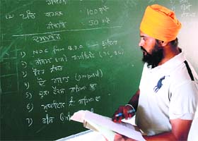 A candidate scrutinises his nomination form before its submission in Rajpura on Thursday