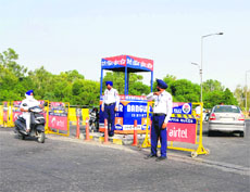 Police personnel deployed on the ITI flyover diverting vehicular traffic through the Dabwali road on Friday. 