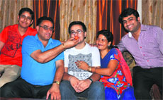 : Jatin Chopra, who topped in the Malwa region in the JEE Advanced examination, flanked by his parents and brothers at his home in Bathinda on Friday evening. 