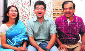 Abhijit Lavania, tricity topper and overall 27th in the JEE (Advanced), shares his success with his parents in Chandigarh on Friday. 