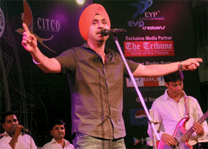 Singer Diljit Dosanjh performs at the Sector 17 Plaza during an event sponsored by The Tribune to mark World Music Day on Friday.