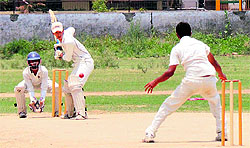 A batsman plays a shot during the Hot Weather Cricket Tournament at SCD Government College in Ludhiana on Friday