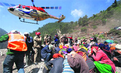 IAF helicopter Sarang lands to rescue pilgrims stranded at Gauri Kund in Uttarakhand on Friday.  PTI 