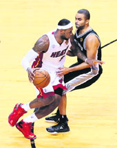 Miami Heats LeBron James drives on Tony Parker of the San Antonio Spurs during Game 7 of the 2013 NBA Finals at American Airlines Arena in Miami on Friday 