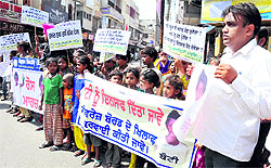 Children of the Appu Society take out a protest march in Bathinda on Saturday