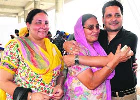 Harnesh Paul Singh of Sector 70, Mohali, meets his mother, Charanjit Kaur, and sister, Kamaldeep Kaur, at the ISBT Sector 43, Chandigarh, on Saturday