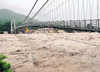  The Ganga flows heavy below Ram Jhula  at Rishikesh. 