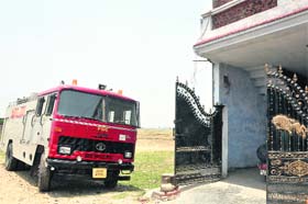 A lone fire tender parked outside the fire station