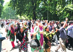 Protesters take out a march in Srinagar on Saturday