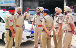 Police Commissioner Paramjit Singh Gill interacts with police officials at Aarti Chowk on Saturday. 