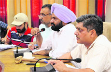 An auction of vanity numbers under way in Ludhiana.