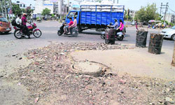 An uneven manhole on Chandigarh Road; and (below) another manhole at Rakh Bagh in Ludhiana. 