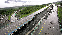 The Trans-Canada Highway damaged from mudslides in Canmore, Alberta, on Friday