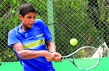 Mritunjay returns a shot during a tennis match at the CLTA, Sector 10, in Chandigarh on Sunday