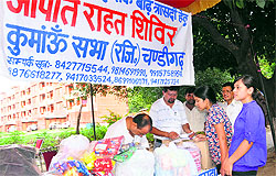 Girls donate money for the flood victims at a camp in Sector 32, Chandigarh, on Sunday