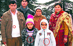 Pandit Sham Lal (extreme left) and his two children who are missing in Uttarakhand. His wife (extreme right) has been rescued