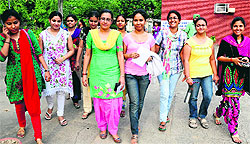 Students come out of an examination centre after appearing in the Joint CSIR UGC NET exam at Guru Nanak Public School, Sector 36, in Chandigarh on Sunday