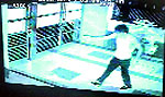 A CCTV camera grab of a miscreant leaving the house