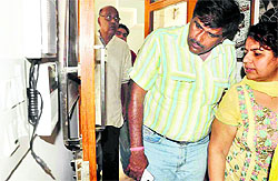 A couple looks at the broken locks of the house where the theft took place in Sector 12-A , Panchkula, on Sunday