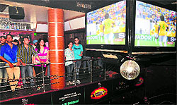 Soccer fans enjoy a match between Italy and Brazil at Score, Sector 8, in Chandigarh on Sunday