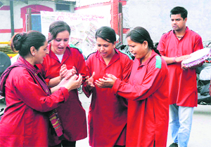 Artistes of the Sambhav Manch stage a street play to collect donations for the disaster-affected people at Dehradun railway station on Sunday. 