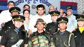 Rohtak MP Deepender Hooda with six IMA cadets belonging to Haryana at a felicitation function in Jhajjar on Sunday.