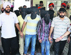 The murder accused in police custody in Jalandhar on Sunday.