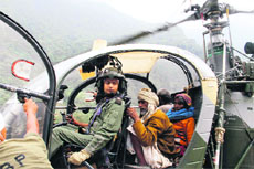 A helicopter set to leave with stranded people in a flood-hit area of Uttarakhand on Sunday. 