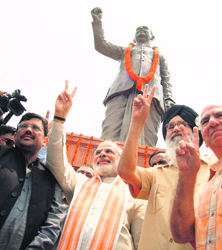 Gujarat Chief Minister Narendra Modi, his Punjab counterpart Parkash Singh Badal and BJP leader and Punjab affairs in charge Shanta Kumar near Shyama Prasad Mukherjee's statue in Madhopur on Sunday.