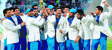 The Indian team celebrates after beating England in the ICC Champions Trophy final at Edgbaston, Birmingham, on Sunday.