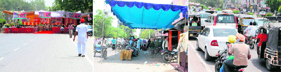 A view of the tent put up in the middle of a road by construction workers in Amritsar; a tent set up for chhabeel and langar on road causes inconvenience to commuters (extreme right) in Amritsar on Monday.