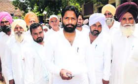 Gardaur Singh Sandhu (centre), who has been elected unopposed as the sarpanch of Kothe Sandhuanwala (Ablu) in Bathinda district, along with panches, who too have been elected unanimously, and his supporters.