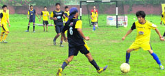 Players in action during a match in the ongoing Chandigarh Football League at Shivalik Public School in Chandigarh on Monday. a tribune photograph