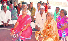 Nasik-based pilgrims, who were evacuated from Gangotri via helicopters, wait for others at the railway station in Haridwar on Monday. 