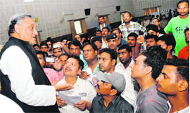 Uttarakhand Chief Minister Vijay Bahuguna addresses relatives of those who are still not traced at the Police Lines in Dehradun on Monday. 
