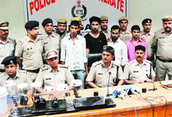 The police with the robbery case accused in Gurgaon.