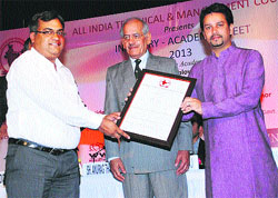Dr Gurcharan Dass (left), Principal, Jan Nayak Chaudhary Devi Lal College of Engineering, Sirsa, receives an award from AICC general secretary Anurag Thakur.