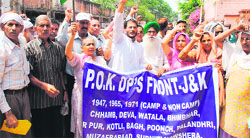 PoK refugees stage a protest in support of their demands in front of the DCs office in Jammu on Monday. Tribune Photo: Inderjeet Singh