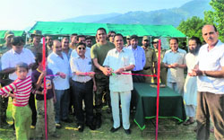 Bhaderwah MLA MS Niaz and MLC Naresh Kumar Gupta inaugurate an Army-sponsored soccer tourney in Batote on Sunday. A Tribune photograph