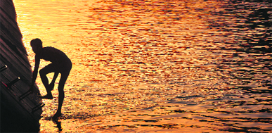 A boy beats the heat at the Sidhwan canal on a hot day in Ludhiana.