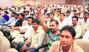 Street vendors take part in a protest at Guru Nanak Bhawan in Ludhiana on Monday.