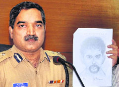 Western Range IGP Pratap Reddy releases the sketch of one of the rape suspects in Mangalore on Monday. 