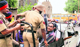 Protesting employees being arrested. 